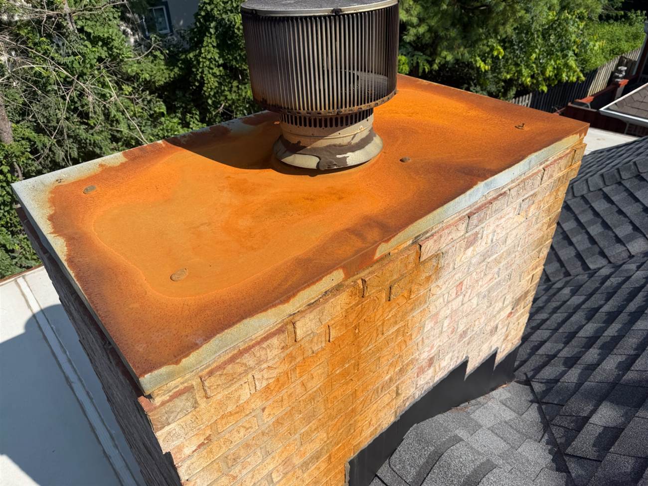 Galvanized chimney chase cover rusted through with water pooling on top — Louisville, KY