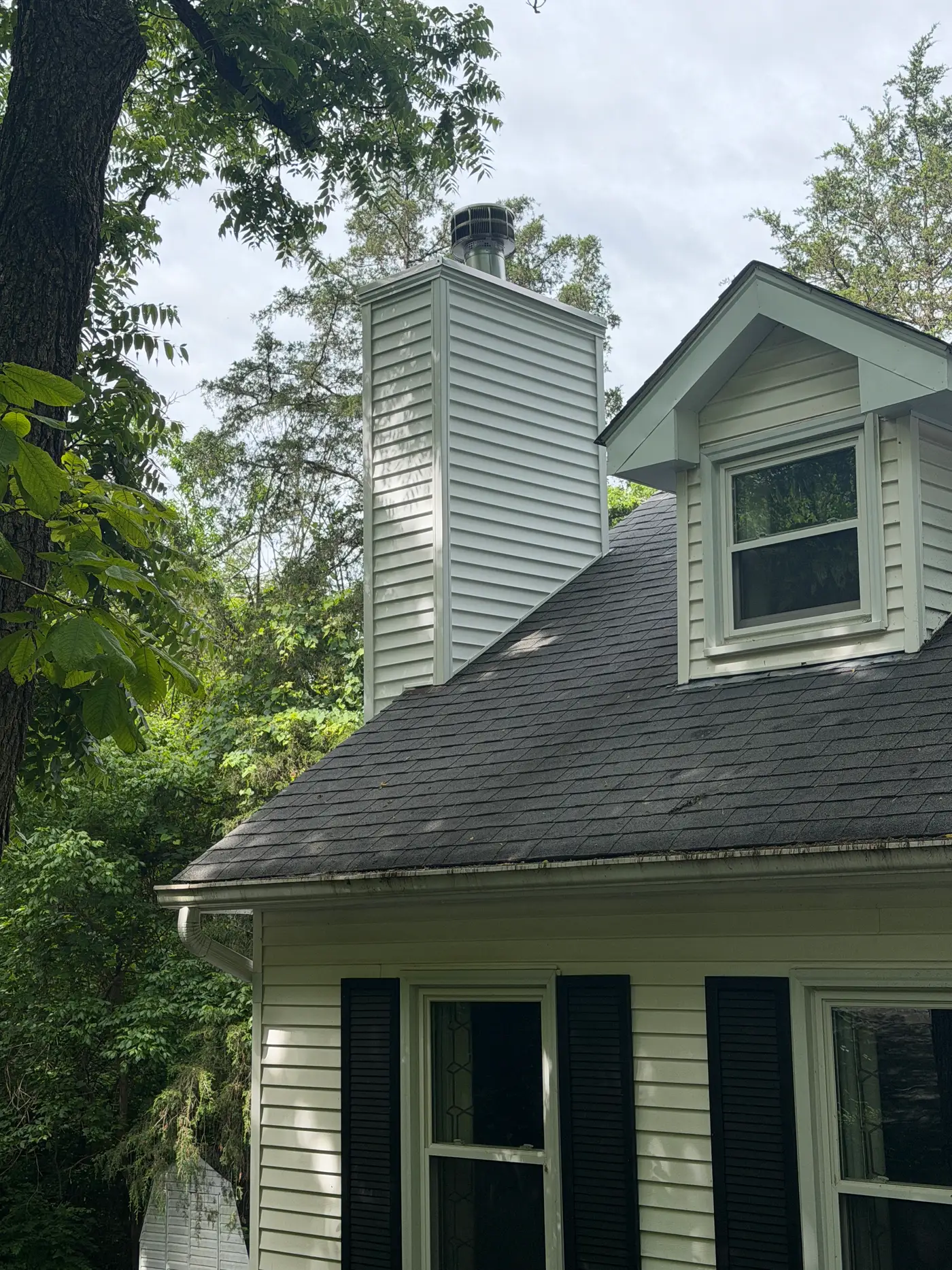 Rebuilt chimney chase with new siding and stainless cap after replacement — Crestwood, KY