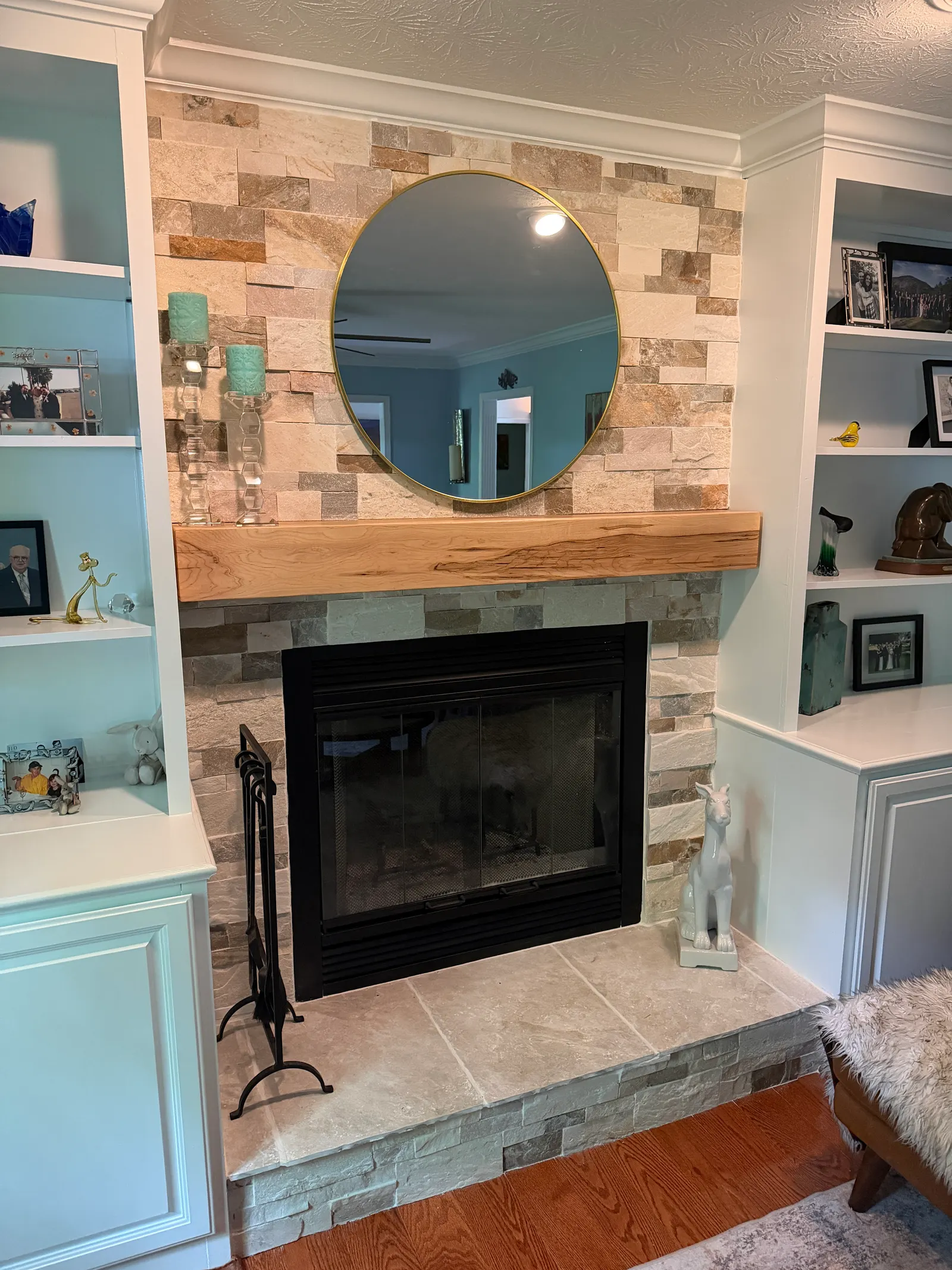 Finished fireplace with new stone veneer surround and wood mantel — Crestwood, KY