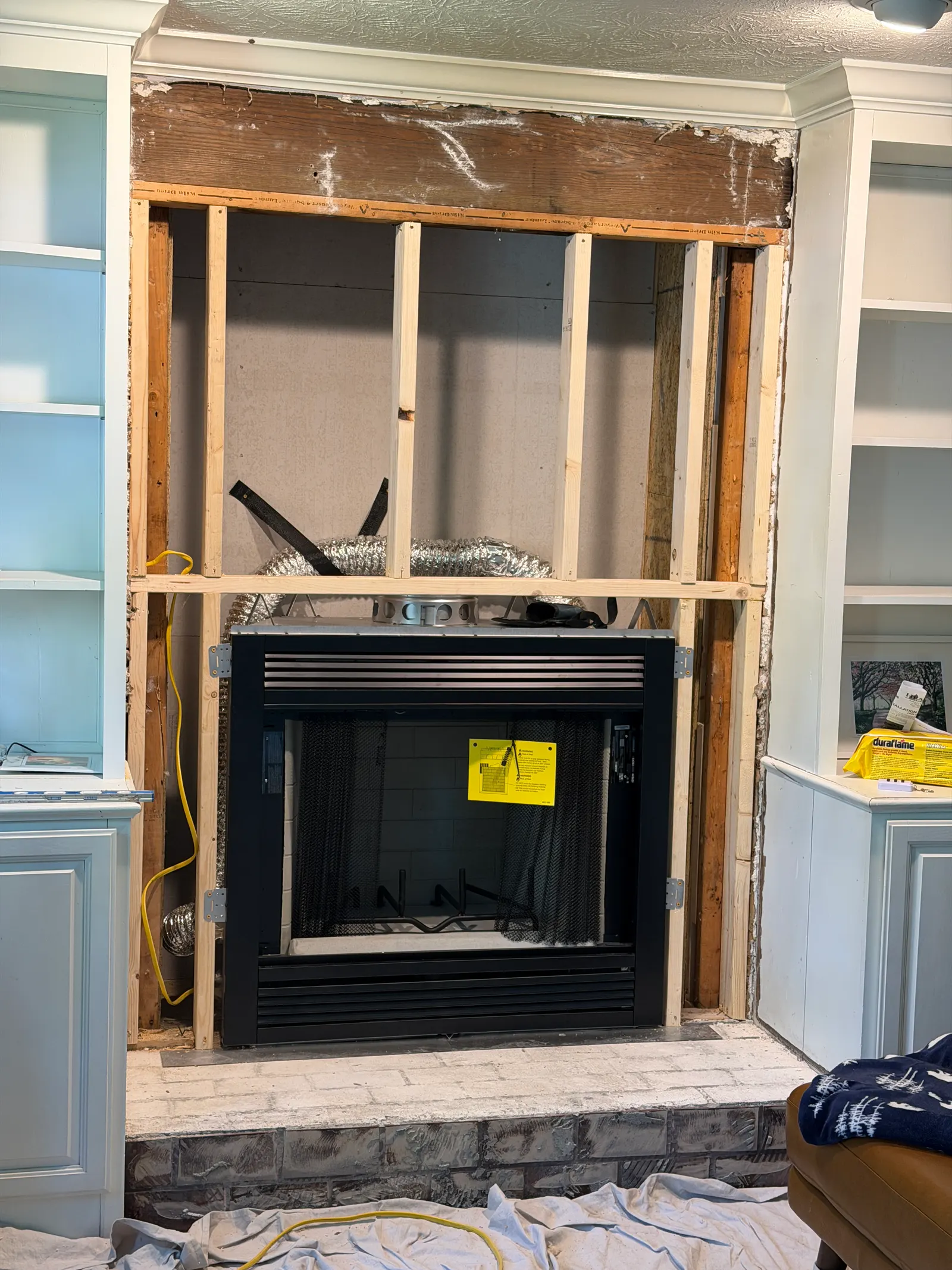 New Majestic wood-burning fireplace set in fresh framing during installation — Crestwood, KY
