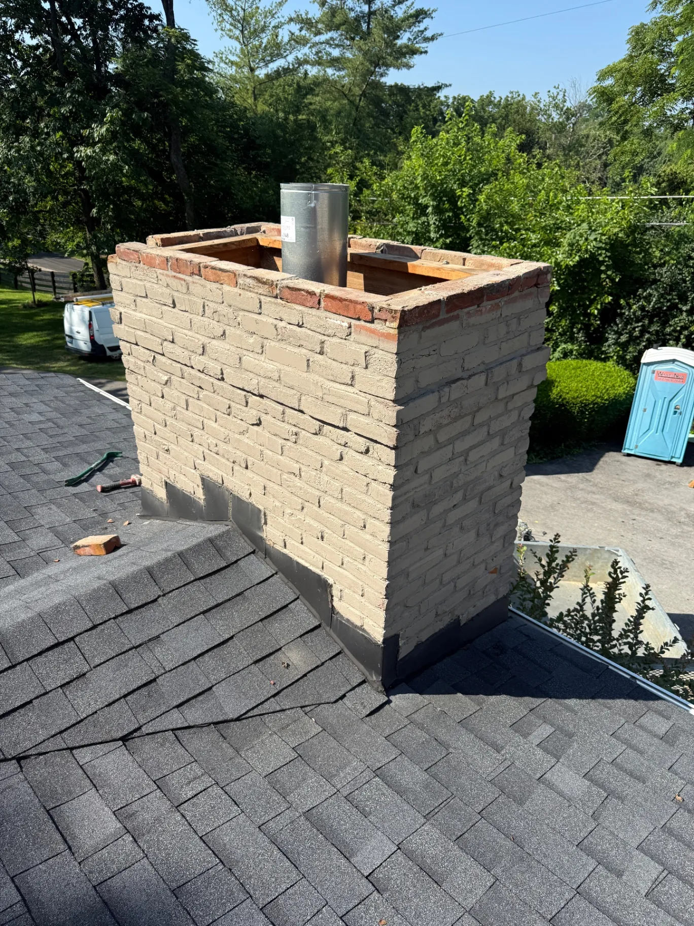 Original chimney showing structural lean from rooftop — Prospect, KY